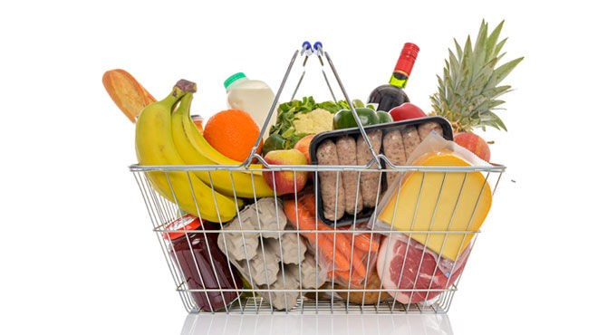 A supermarket basket full of groceries used to illustrate an article about new perks from Select Apartments