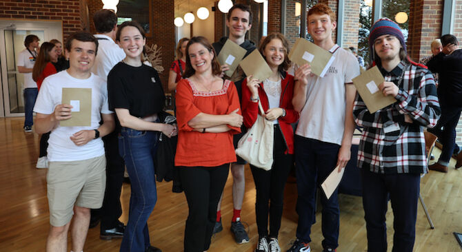 Head of Sixth Form, Helen Taylor, with some of the Upper Sixth opening their envelopes