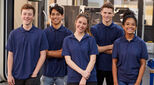 Portrait Of Engineering Apprentices In Factory