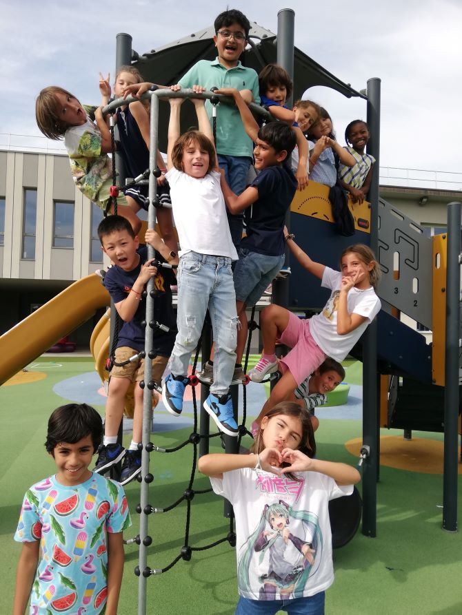 Image of children on play equipment at ASM