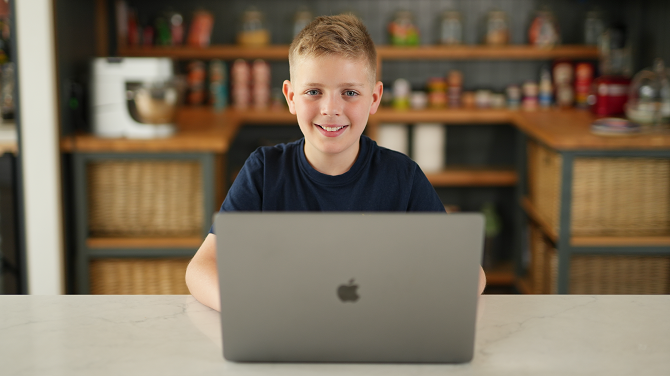 Kings-InterHigh-smiling-student-laptop