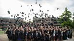 ACS-Cobham-students-toss-their-graduation-caps-in-the-air-in-celebration