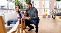 Young-couple-looking-at-laptop