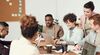 Image-of-group-people-at-shared-desk-laptop